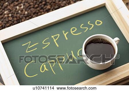 Coffee, Close-up of a cup of espresso cappuccino on a small blackboard View Large Photo Image Picture - Coffee, Close-up of a cup of espresso cappuccino on a small blackboard. Fotosearch