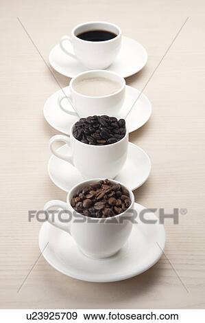 Coffee, Coffee Bean, Close-up of coffee and coffee beans on four cups View Large Photo Image Stock Photo - Coffee, Coffee Bean, Close-up of coffee and coffee beans on four cups. Fotosearch