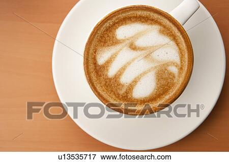 Stock Photo - Coffee Culture, Close-up of a cup of cappuccino with pattern. Fotosearch
