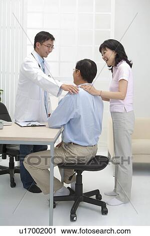 Stock Image - Couple, Couple going to see the doctor. Fotosearch
