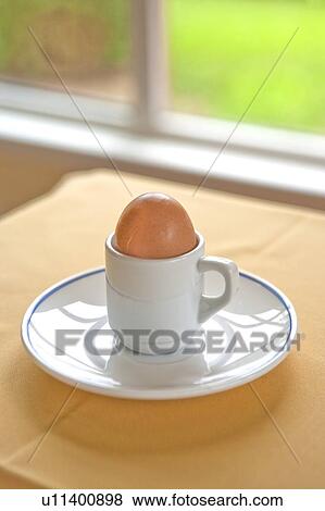 Egg in Eggcup and plate View Large Photo Image Stock Photo - Egg in Eggcup and plate. Fotosearch