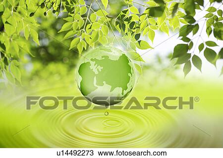 Stock Image - Environmental Conservation, Digitally generated image of the earth and green leaves. Fotosearch