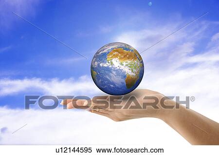 Environmental Conservation, Digitally generated image of human hand holding the earth View Large Photo Image Stock Photography - Environmental Conservation, Digitally generated image of human hand holding the earth. Fotosearch