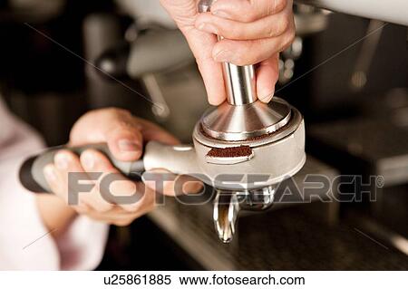 Food And Drink Industry, Close-up of human hands holding an espresso maker View Large Photo Image Stock Photography - Food And Drink Industry, Close-up of human hands holding an espresso maker. Fotosearch