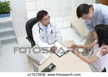 Stock Photo - Medical Exam, Couple going to see the doctor. Fotosearch