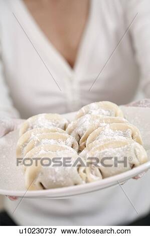 Stock Photo - New Year, Close-up of a plate of dumplings. Fotosearch