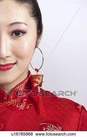 New Year, Close-up of young woman wearing Chinese traditional clothing and smiling, View Large Photo Image Stock Photo - New Year, Close-up of young woman wearing Chinese traditional clothing and smiling,. Fotosearch