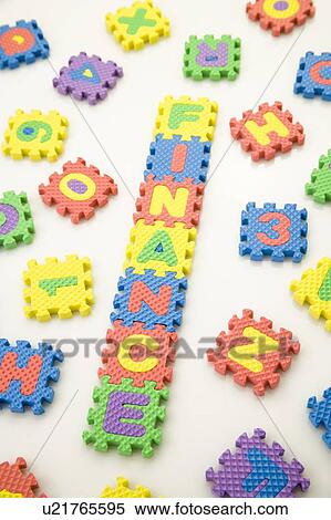 Stock Photography - Puzzle mat forming the word of "Finance". Fotosearch