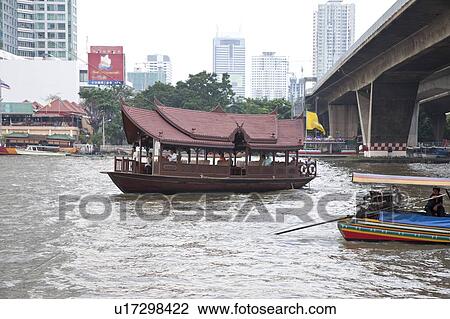 Stock Image - Thailand, Bangkok, Chao Praya river, Tourboat. Fotosearch