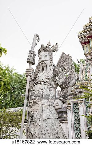 Stock Image - Thailand, Bangkok, Wat Pho, Wat Pho, Door God. Fotosearch