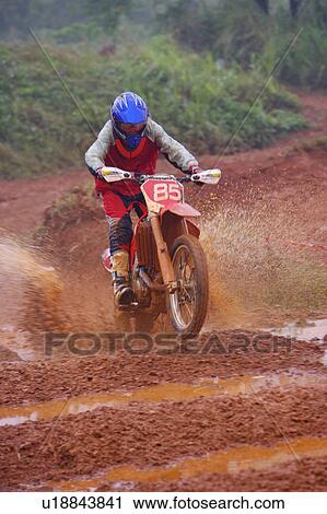 Young man motocross over field. View Large Photo Image Stock Image - Young man motocross over field.. Fotosearch