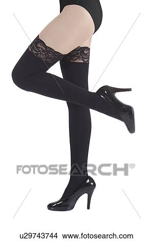 Young woman wearing sexy stockings and high heels View Large Photo Image Picture - Young woman wearing sexy stockings and high heels. Fotosearch