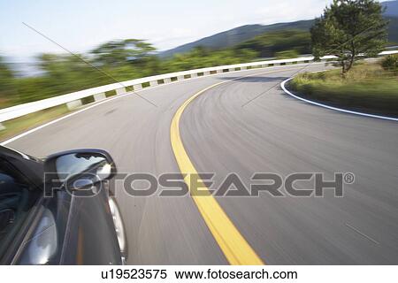 A Car Running on Winding Road in Mountain View Large Photo Image Stock Photography - A Car Running on Winding Road in Mountain. Fotosearch