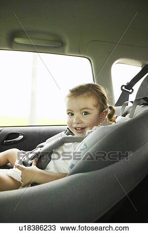 Stock Image - A girl in a car. Fotosearch
