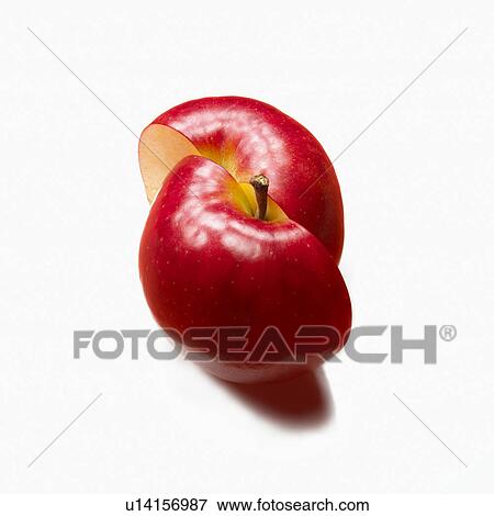 Apple sliced in half, white background View Large Photo Image Stock Photo - Apple sliced in half, white background. Fotosearch