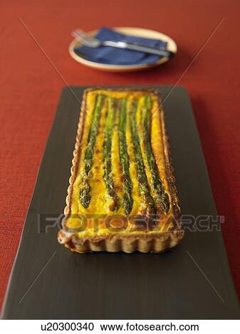 Stock Image - Asparagus quiche, close up. Fotosearch