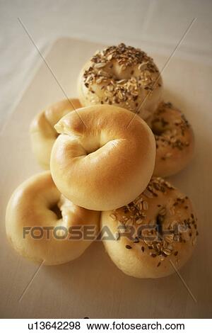Stock Photo - Bagels on cutting board, close up. Fotosearch