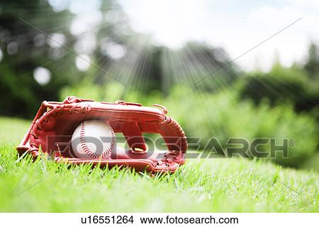Baseball inside baseball glove and sunbeam, CG View Large Photo Image Picture - Baseball inside baseball glove and sunbeam, CG. Fotosearch