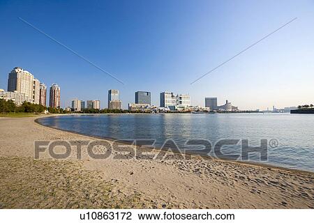Stock Image - Beach with Tokyo skyline. Fotosearch