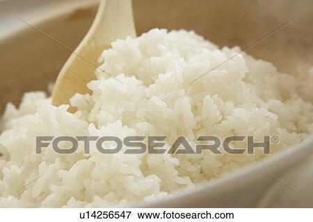 Boiled rice being stirred in crock pot, close up View Large Photo Image Stock Photo - Boiled rice being stirred in crock pot, close up. Fotosearch