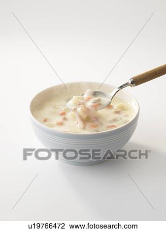 Stock Image - Bowl of chowder, white background. Fotosearch
