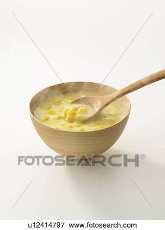 Stock Photo - Bowl of corn soup, white background. Fotosearch