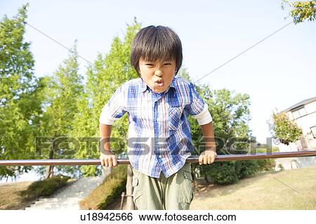 Boy at gymnastics bar View Large Photo Image Stock Photograph - Boy at gymnastics bar. Fotosearch