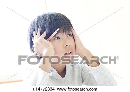 Boy frustrated at cram school View Large Photo Image Picture - Boy frustrated at cram school. Fotosearch