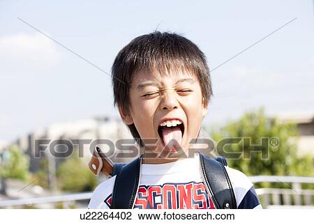 Boy sticking out tongue View Large Photo Image Stock Image - Boy sticking out tongue. Fotosearch