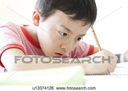 Boy studying at cram school View Large Photo Image Stock Photograph - Boy studying at cram school. Fotosearch