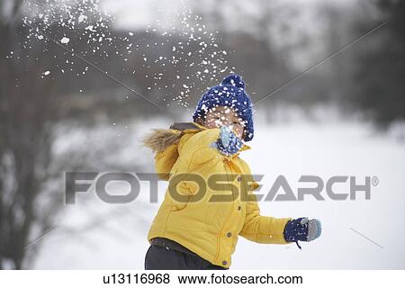 Boy throwing snowball View Large Photo Image Stock Photo - Boy throwing snowball. Fotosearch
