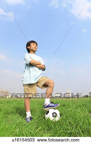 Stock Image - Boy with soccer ball. Fotosearch