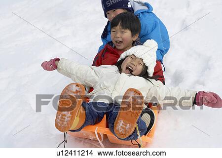 Boys and girl on a sled View Large Photo Image Picture - Boys and girl on a sled. Fotosearch