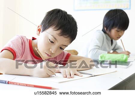 Stock Photography - Boys studying at cram school. Fotosearch