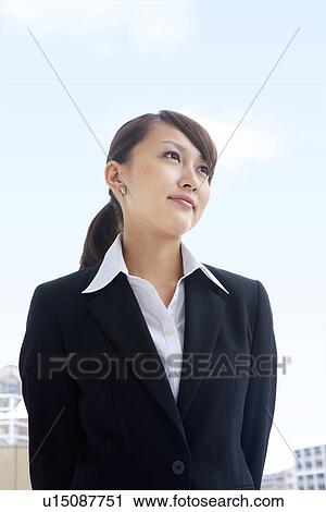 Businesswoman standing outdoors View Large Photo Image Stock Image - Businesswoman standing outdoors. Fotosearch