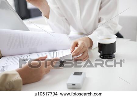 Picture - Businesswomen having a meeting. Fotosearch