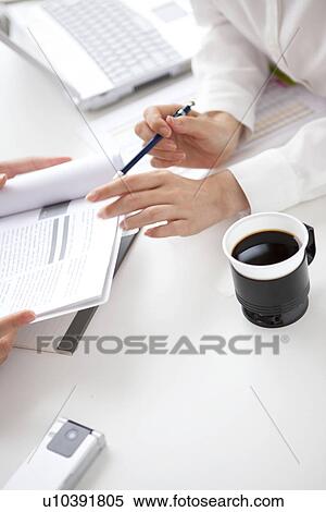 Stock Photography - Businesswomen having a meeting. Fotosearch
