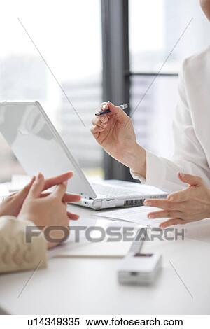 Businesswomen having a meeting View Large Photo Image Stock Photography - Businesswomen having a meeting. Fotosearch