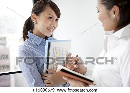 Businesswomen talking View Large Photo Image Stock Photo - Businesswomen talking. Fotosearch