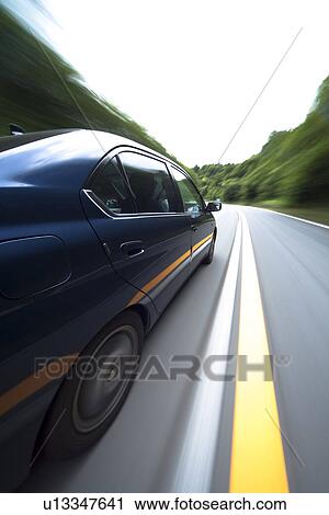 Car driving on road View Large Photo Image Stock Image - Car driving on road. Fotosearch