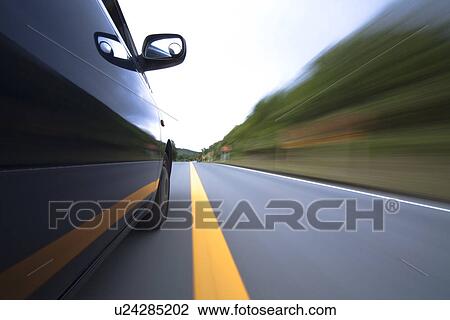 Car driving on road View Large Photo Image Stock Image - Car driving on road. Fotosearch