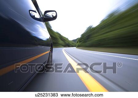 Stock Image - Car driving on road. Fotosearch