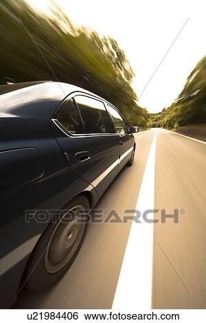 Stock Photograph - Car driving on road. Fotosearch