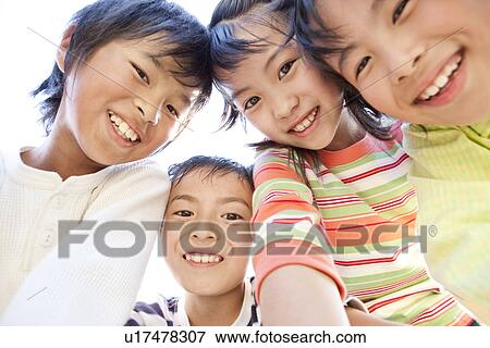 Stock Photo - Children looking at camera. Fotosearch
