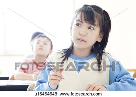 Stock Photo - Children studying at cram school. Fotosearch