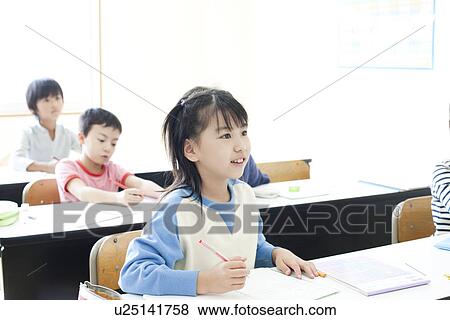 Stock Photo - Children studying at cram school. Fotosearch