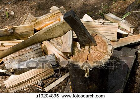 Stock Photography - Chopped wood and axe. Fotosearch