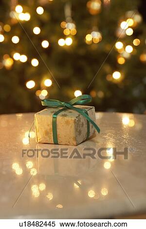Stock Photography - Christmas present on table, differential focus. Fotosearch