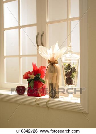 Stock Photograph - Christmas present on window sill. Fotosearch