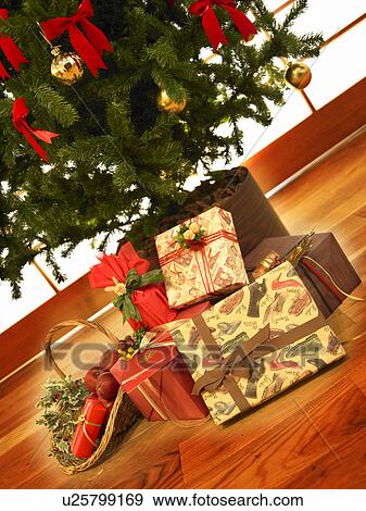 Christmas presents under Christmas tree View Large Photo Image Stock Photo - Christmas presents under Christmas tree. Fotosearch